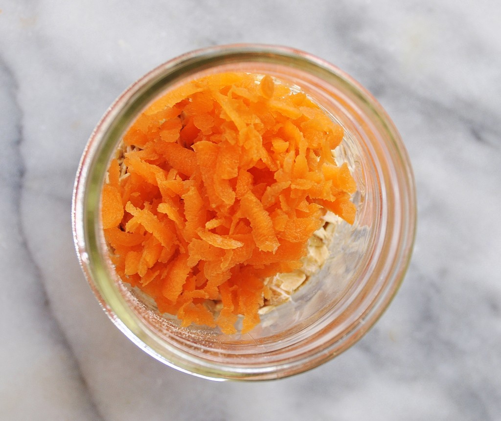 Grated Carrots in a jar on a marble surface