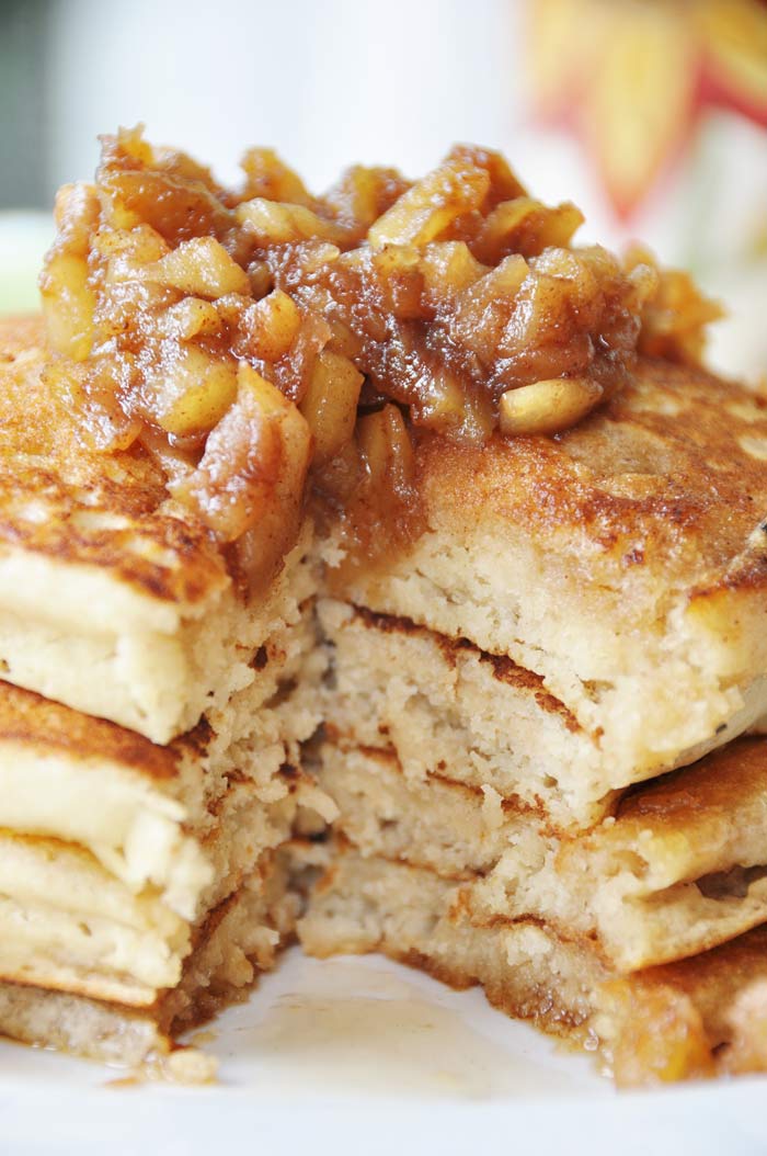 A close up shot of the inside of a stack of Old Fashioned Fluffy Vegan Pancakes with Apple Spice Compote on top. 