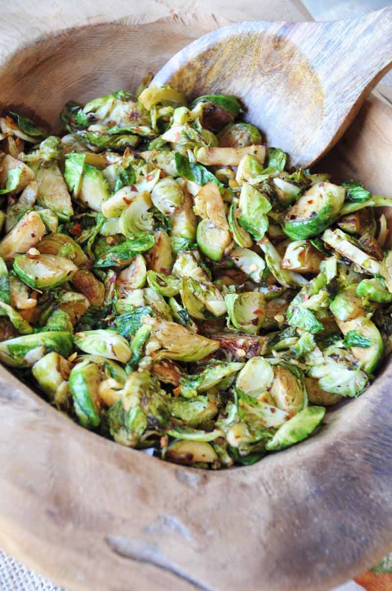 Spicy Stir-Fried Brussels Sprouts! This crisp, spicy, slightly sweet and tangy Brussels sprouts recipe will become on of your favorites. Perfect for your holiday meal! www.veganosity.com