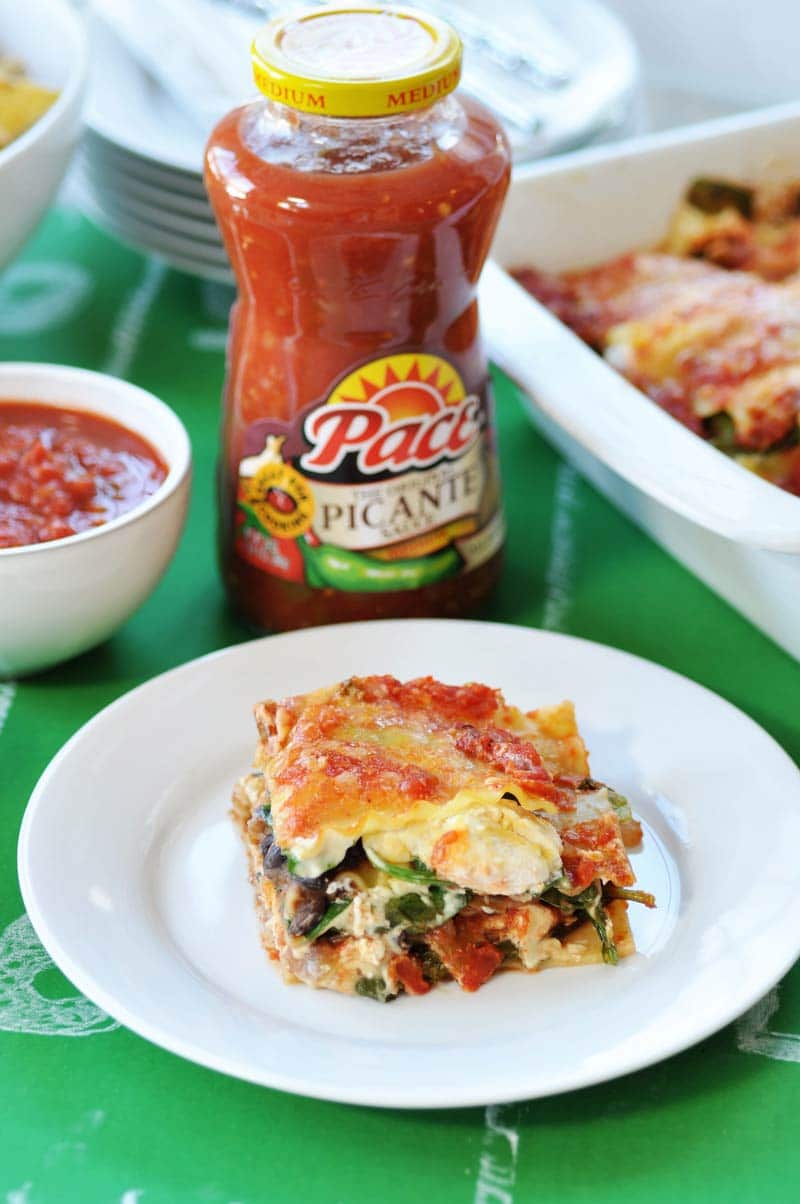 Vegan Mexican Lasagna! #KickUpTheFlavor with Pace Picante Sauce. This lasagna recipe is filled with spicy Mexican ingredients that are perfect for game day or any party with a hungry crowd. www.veganosity.com #ad
