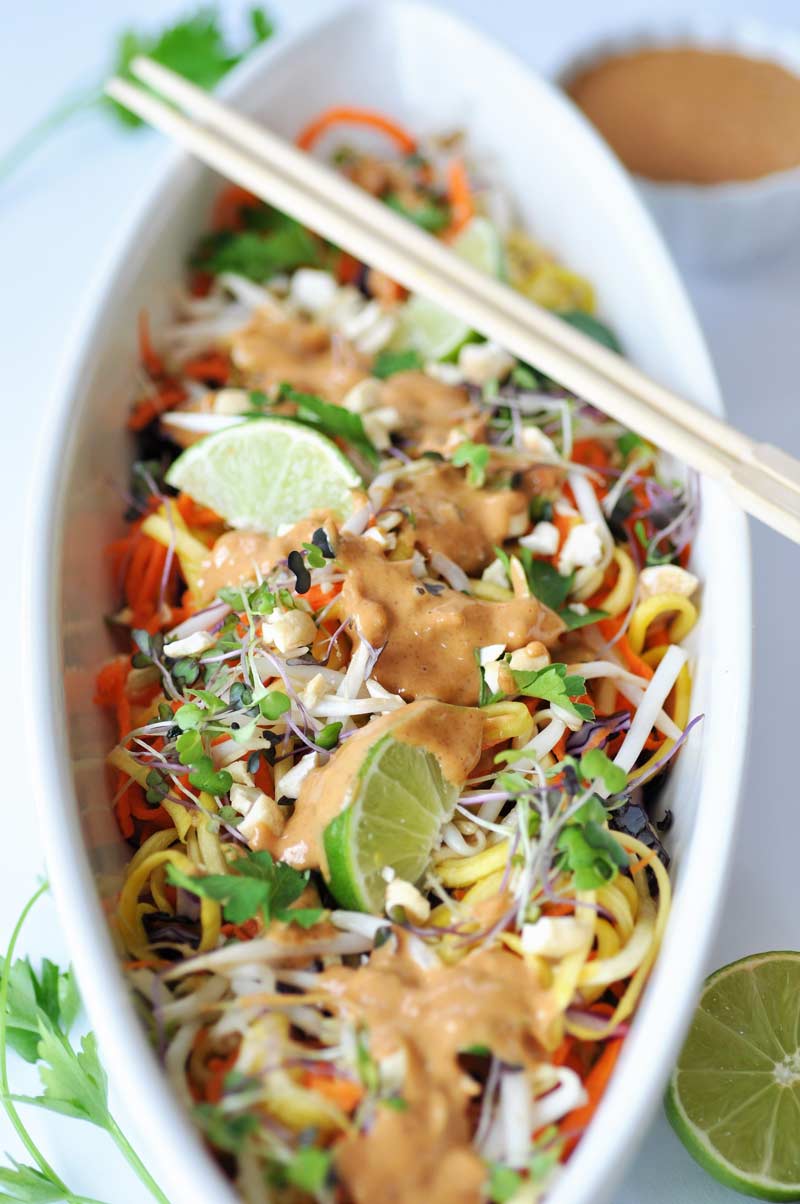 Raw Super Sprouts Pad Thai with a Spicy Peanut Sauce! This is the most delicious raw recipe I've had yet. Yellow squash, carrots, red cabbage, sprouts, and a creamy peanut sauce. www.veganosity.com