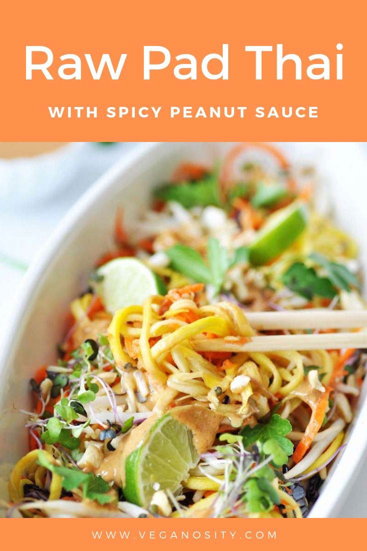 A Pinterest pin for Raw Pad Thai with pad Thai in a white boat shaped bowl with a hand taking some of the food with chopsticks.