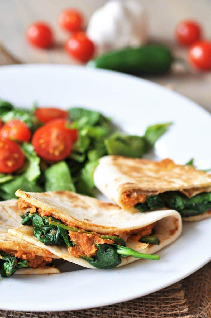 Spicy Mexican Hummus Quesadillas! This flavorful and spicy quesadilla recipe is so quick and easy to make, and it's healthy and delicious. What more could you want? www.veganosity.com