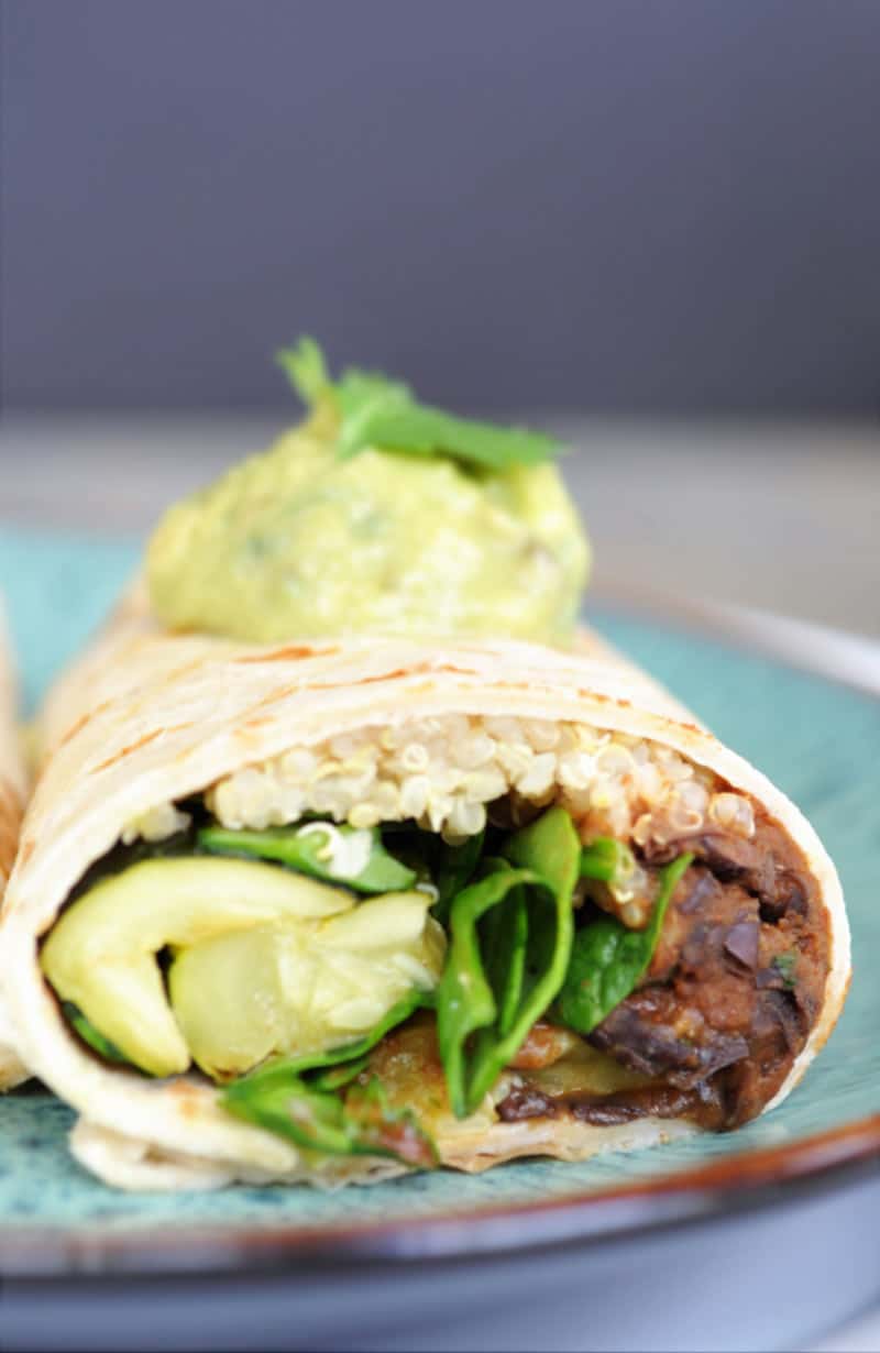 Roasted Veggie, Black Bean & Quinoa Burritos! One tortilla filled with hearty and healthy plant-based vegan food. One of my new favorite recipes. www.veganosity.com