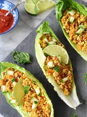 Spicy Sofritas Tofu Lettuce Wraps! This spicy tofu lettuce wrap recipe is perfect for a busy weeknight. Filled with protein, veggies, and lots of flavor. www.veganosity.com