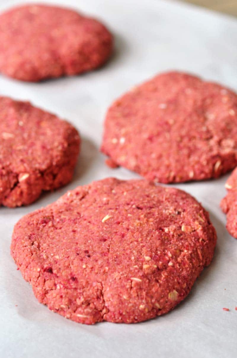 Vegan Beet Burgers that Won't Fall Apart on the Grill! This veggie burger recipe is made with aquafaba. It;s the perfect binder, and it holds the burger together like nothing else does. www.veganosity.com