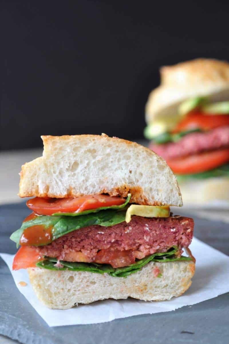 Vegan Beet Burgers that Won't Fall Apart on the Grill! This veggie burger recipe is made with aquafaba. It;s the perfect binder, and it holds the burger together like nothing else does. www.veganosity.com