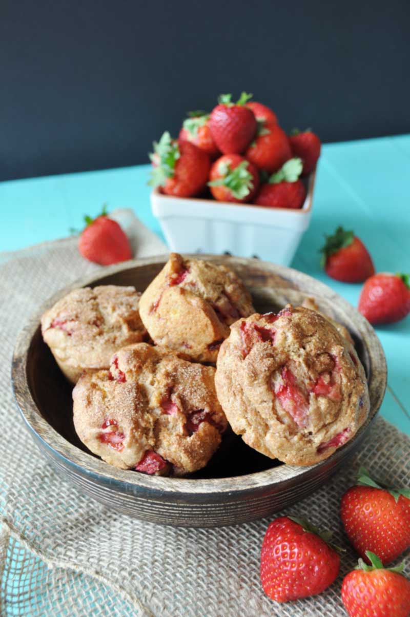 Vegan Whole Wheat Strawberry Muffins! This healthy and delicious recipe is bursting with fresh seasonal strawberries and nutty whole wheat flour. You have to try them. www.veganosity.com