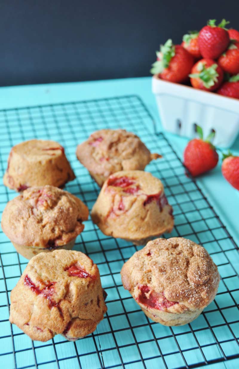 Vegan Whole Wheat Strawberry Muffins! This healthy and delicious recipe is bursting with fresh seasonal strawberries and nutty whole wheat flour. You have to try them. www.veganosity.com