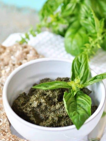 This classic vegan walnut pesto recipe is so easy and fast to make. The fresh basil and walnuts come together to make the perfect dip, spread, or sauce. www.veganosity.com