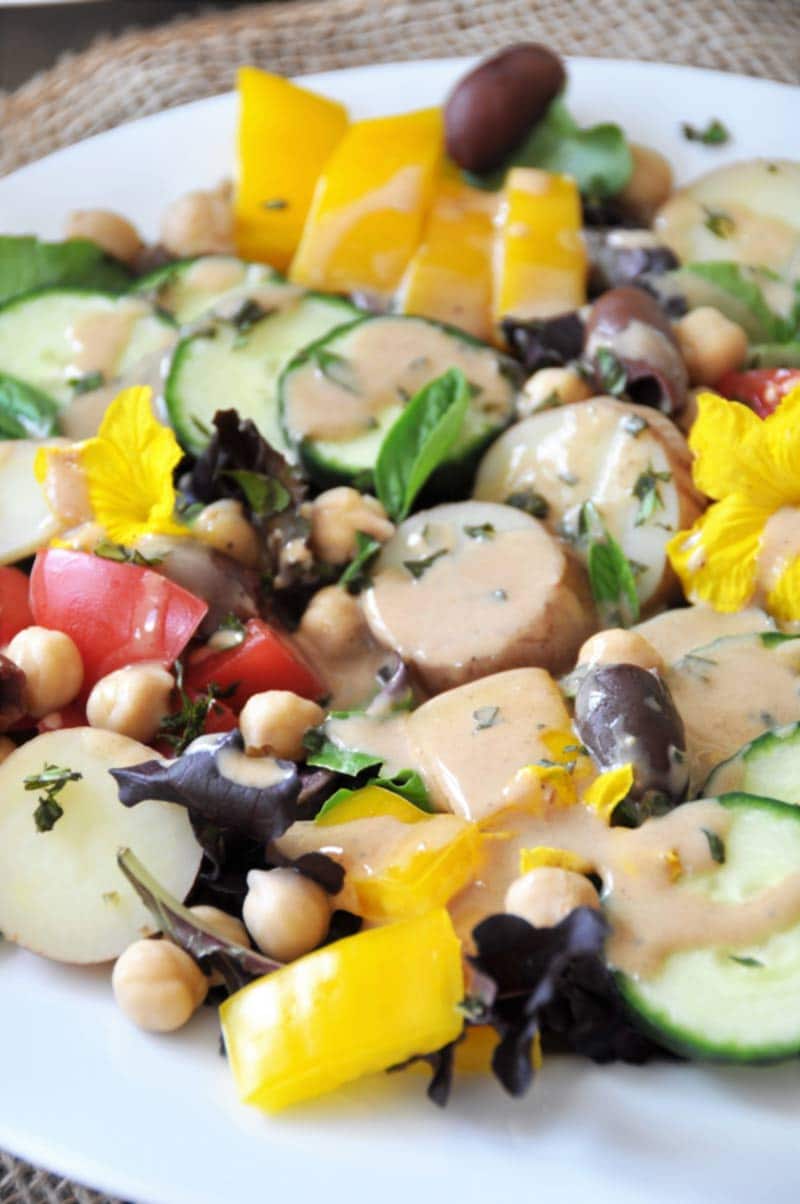 The perfect vegan nicoise salad for two! Made with chickpeas, fresh cucumbers, and a tangy Dijon mustard dressing. www.veganosity.com