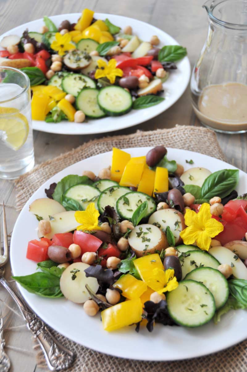 The perfect vegan nicoise salad for two! Made with chickpeas, fresh cucumbers, and a tangy Dijon mustard dressing. www.veganosity.com