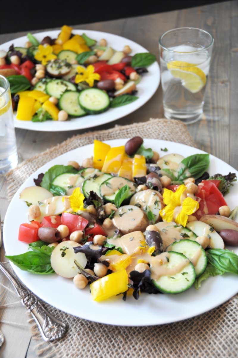 The perfect vegan nicoise salad for two! Made with chickpeas, fresh cucumbers, and a tangy Dijon mustard dressing. www.veganosity.com