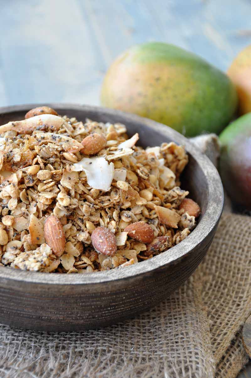 Make your own tropical granola with dried mango, coconut, almonds, watermelon seeds, oats, and chia seeds. SO delicious! www.veganosity.com