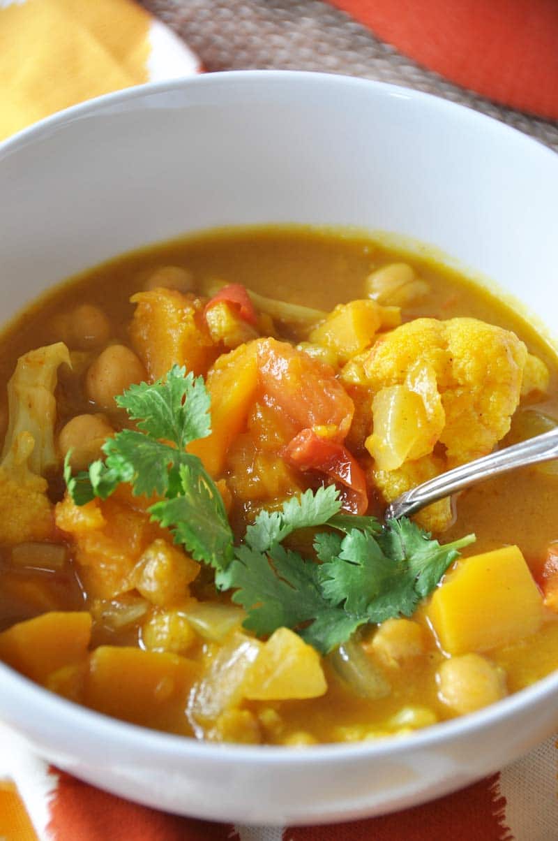 Yellow curry, pumpkin, butternut squash, and chickpeas are what makes this stew hearty, satisfying, and healthy. The aromatic spices make it incredible. www.veganosity.com