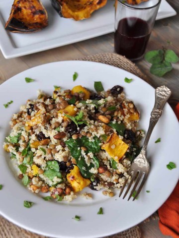 This warm salad with roasted acorn squash, lentils, quinoa, and sage dressing is perfect for fall! www.veganosity.com