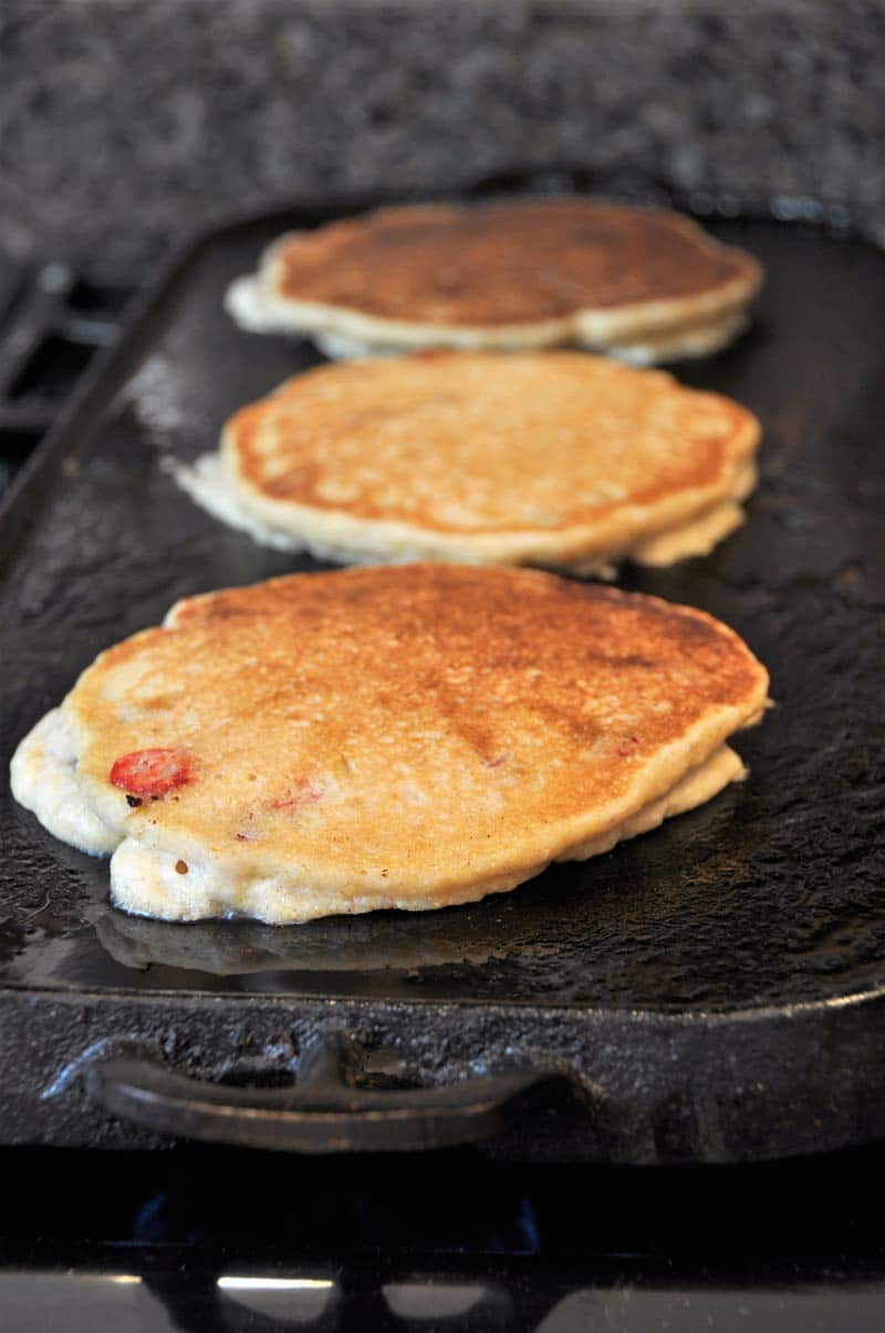 Vegan Cranberry Orange Pancakes for breakfast! Dairy and egg-free recipe, fluffy, and delicious! www.veganosity.com