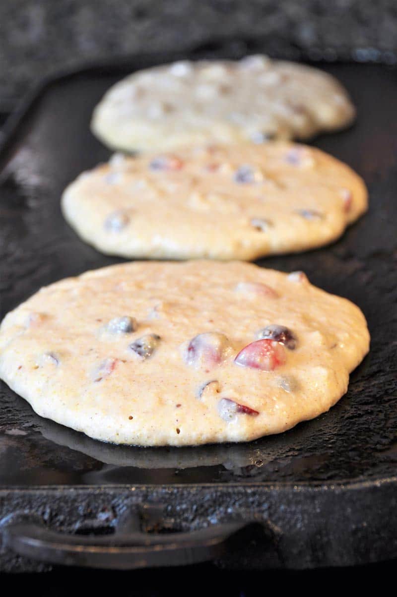 Vegan Cranberry Orange Pancakes for breakfast! Dairy and egg-free recipe, fluffy, and delicious! www.veganosity.com