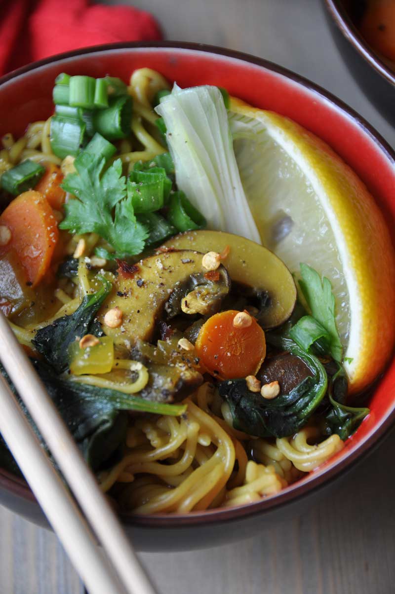 Vegan & Gluten-Free ramen noodle soup filled with delicious flavors and veggies! So healthy with anti-inflammatory turmeric and ginger! www.veganosity.com