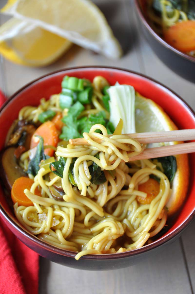 Vegan & Gluten-Free ramen noodle soup filled with delicious flavors and veggies! So healthy with anti-inflammatory turmeric and ginger! www.veganosity.com