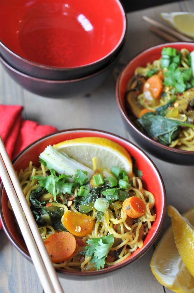 Vegan & Gluten-Free ramen noodle soup filled with delicious flavors and veggies! So healthy with anti-inflammatory turmeric and ginger! www.veganosity.com