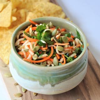 Jicama, carrots, Pablano pepper, in a refreshing lime dressing, topped with roasted pepitas! The perfect slaw salsa appetizer!