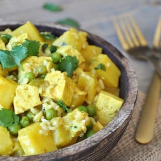 A simple and easy curry dish with tofu, pineapple, peas, and cilantro. The perfect healthy and quick dinner recipe.