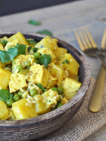 A simple and easy curry dish with tofu, pineapple, peas, and cilantro. The perfect healthy and quick dinner recipe.