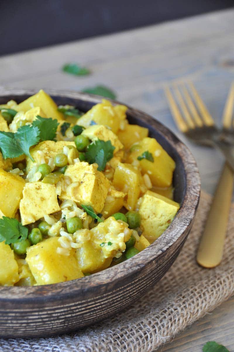 A simple and easy curry dish with tofu, pineapple, peas, and cilantro. The perfect healthy and quick dinner recipe.