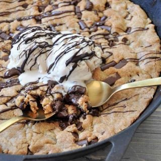 One big vegan chocolate chip cookie in an iron skillet! The perfect dessert for a party. Dairy and egg-free.