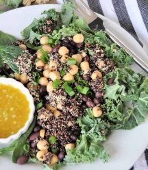 A protein packed superfood salad with black beans and chickpeas, kale and spinach. Healthy, delicious, and perfect for lunch or dinner.