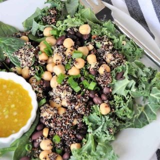 A protein packed superfood salad with black beans and chickpeas, kale and spinach. Healthy, delicious, and perfect for lunch or dinner.