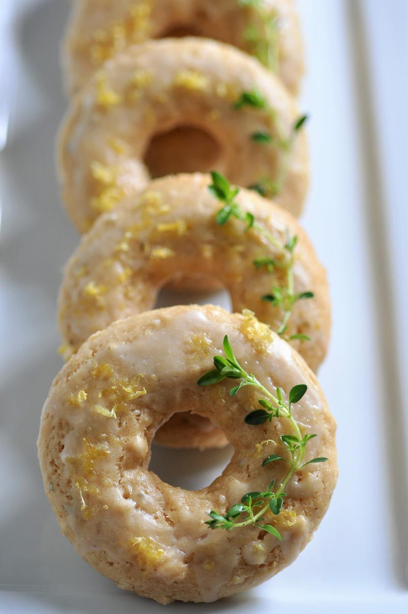 Dairy and Egg-free lemon & thyme doughnuts. Bursting with lemon flavor, perfect for breakfast or a snack!