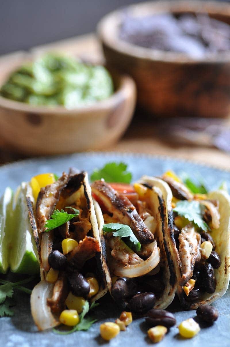 Spicy black beans, corn, and shitake mushroom tacos! The best appetizer or quick meal.
