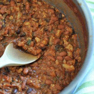 Healthy, low fat, and delicious vegan chili in a pot with a wood spoon