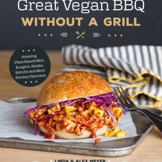 Book cover for Great Vegan BBQ Without a Grill with a pulled BBQ Sandwich on a silver tray with a fork and a blue striped napkin with yellow trim