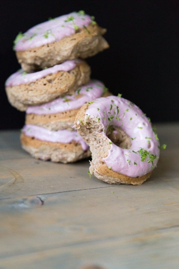 Strawberry Margarita Donuts with lime zest and one donut partially eaten