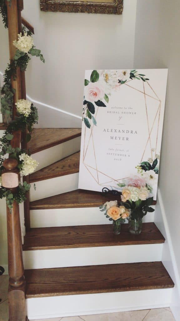 Bridal Shower Sign with fresh flowers and garland on wood stairs