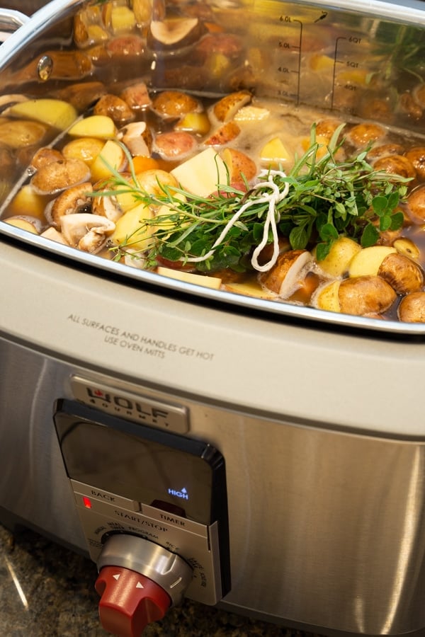 Vegan beef stew simmering in a Wolf Gourmet Multi-Function Cooker