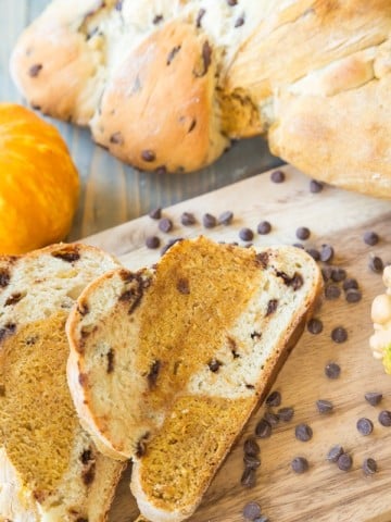 Pumpkin Chocolate Chip braided bread with chocolate chips on a wood board