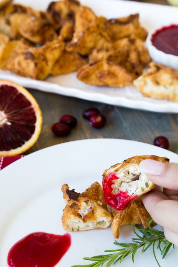 Stuffed ricotta and shiitake mushrooms dipped in an orange cranberry sauce