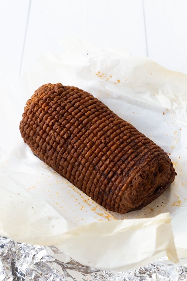 A baked Field Roast Celebration Roast on a piece of white parchment paper