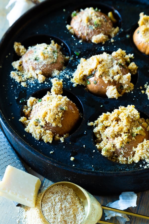 Roasted Garlic Mushrooms in a black iron pan ready to go in the oven. 