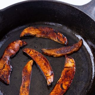 Mushroom bacon cooked in a cast-iron skillet