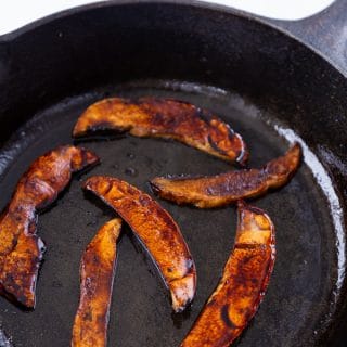 Mushroom bacon cooked in a cast-iron skillet