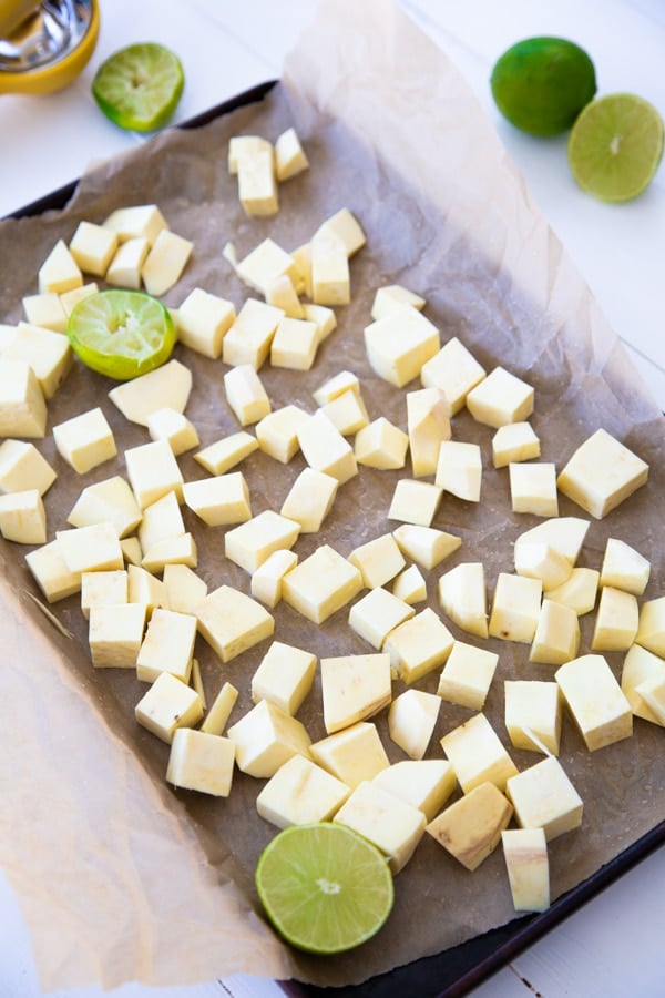 a baking sheet with cubed sweet potatoes