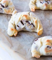 Five empandas on a cookie sheet with parchment paper
