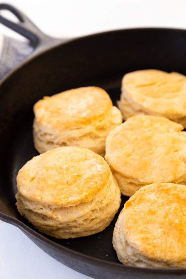A cast-iron skillet with homemade biscuits
