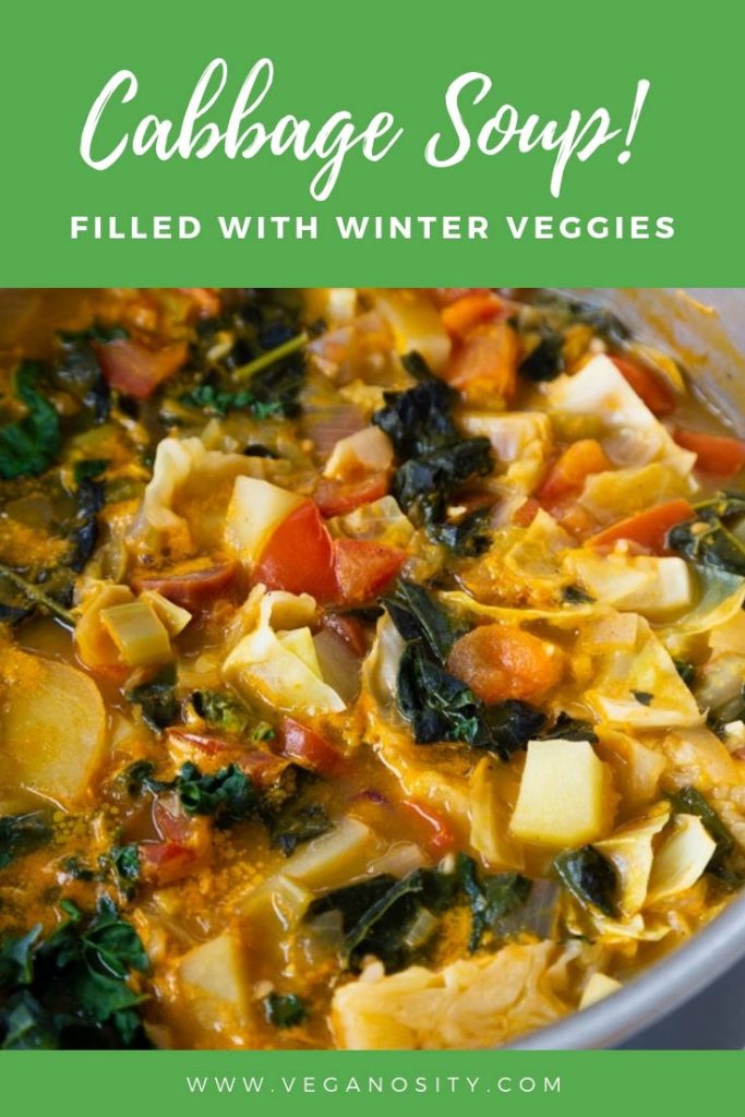 A Pinterest pin for vegan cabbage soup with a picture of the soup in a pot.