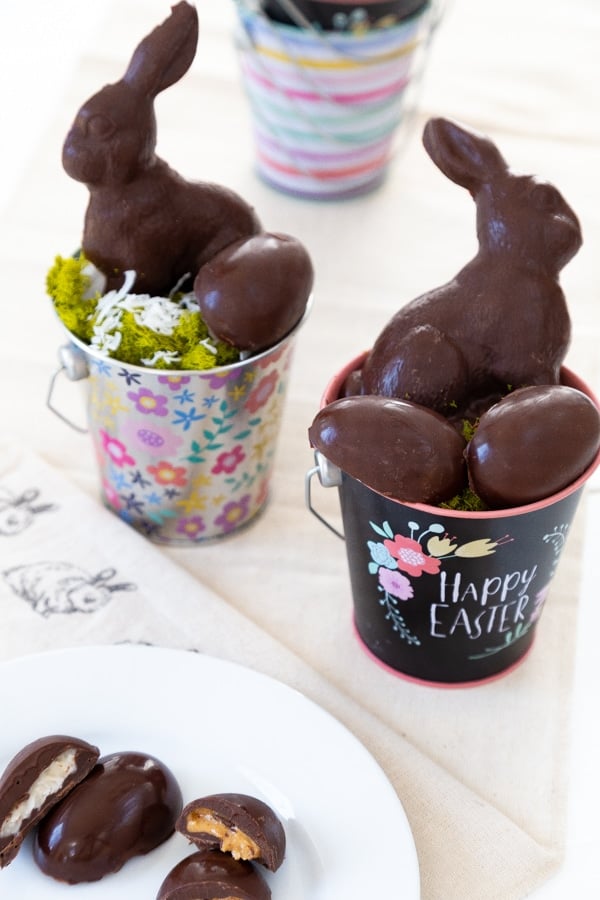 Two Easter baskets with chocolate eggs and rabbits